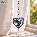 hummingbird heart suncatcher in a window