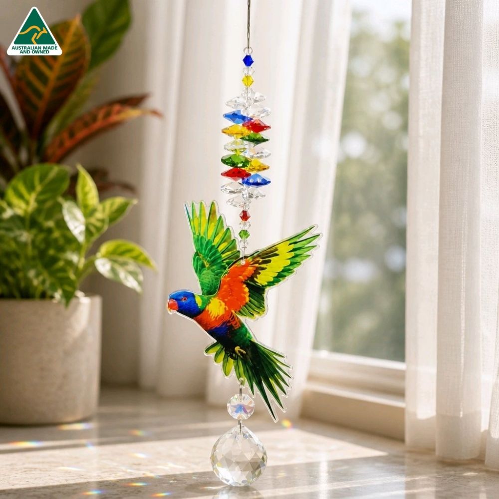 lorikeet suncatcher in a window