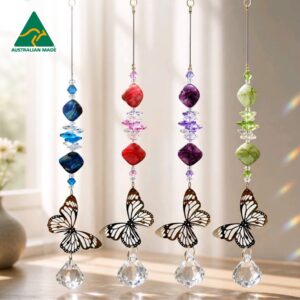 Small butterfly crystal suncatcher with stainless steel filigree butterfly, red iridised shell beads and clear crystal ball.